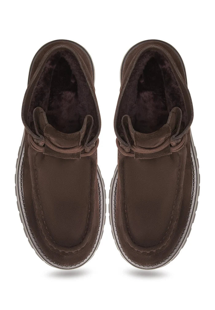 A close-up image of stylish brown suede lace-up ankle boots for women by Mavi, perfect for completing your fall/winter wardrobe.