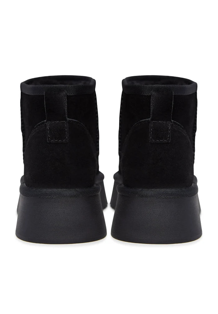 Stay stylish and cozy this winter with a pair of black suede platform boots - the perfect winter footwear choice.