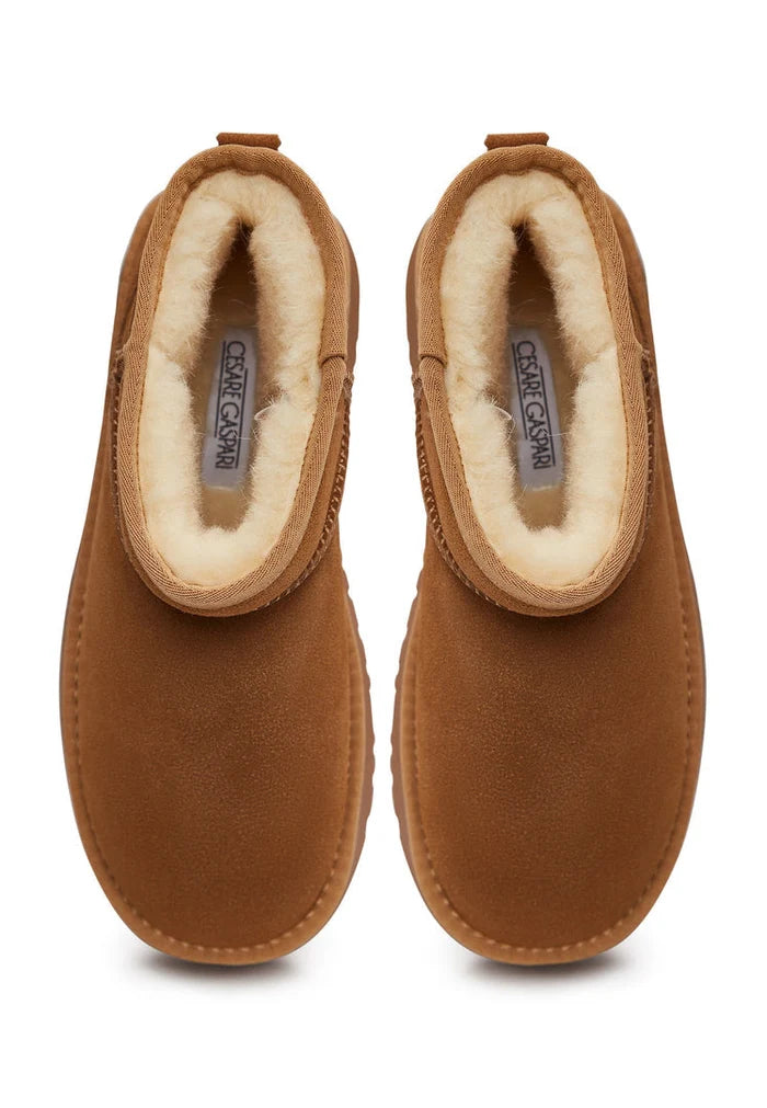 A stylish pair of brown suede winter platform boots, perfect for adding a fashionable flair to your winter outfits.