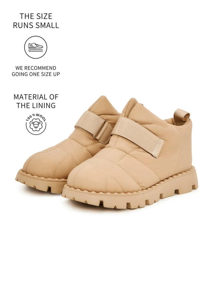 Stay warm and stylish in these beige suede winter boots with cozy wool lining, the perfect cold weather footwear.