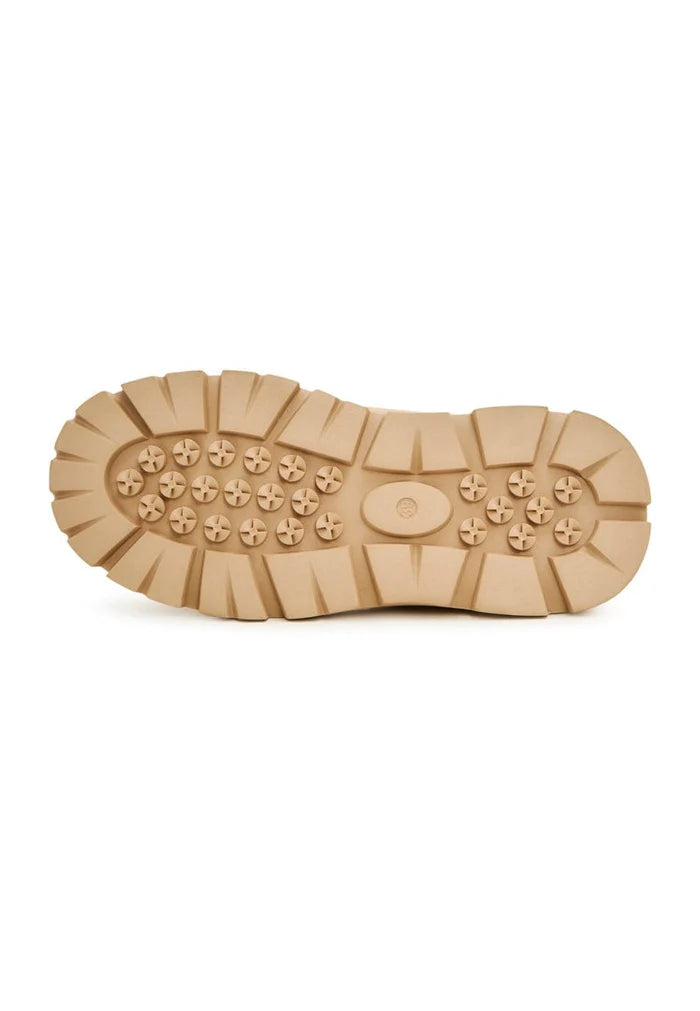 A pair of cozy winter boots in beige suede with wool lining, perfect for cold weather.