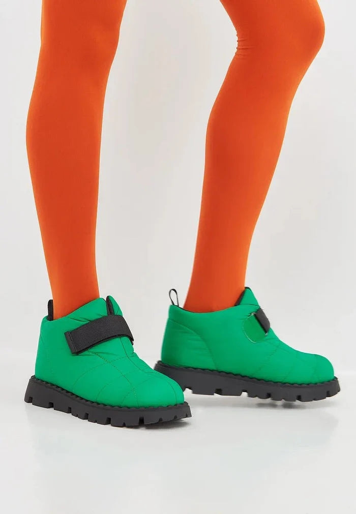 Stay warm and stylish this winter with these cozy green suede boots lined with wool. Perfect for cold weather days!