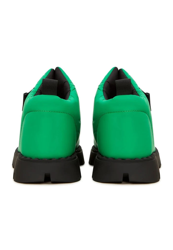 Stay warm and stylish this winter with these green suede wool-lined boots, perfect for cold weather adventures.