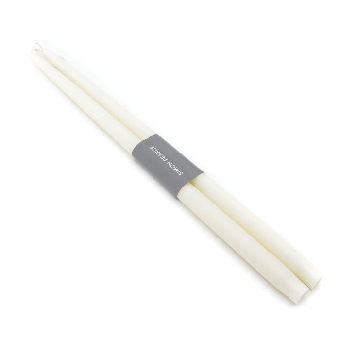Two ivory taper candles bundled together with a gray paper band labeled "Spice Novalis".