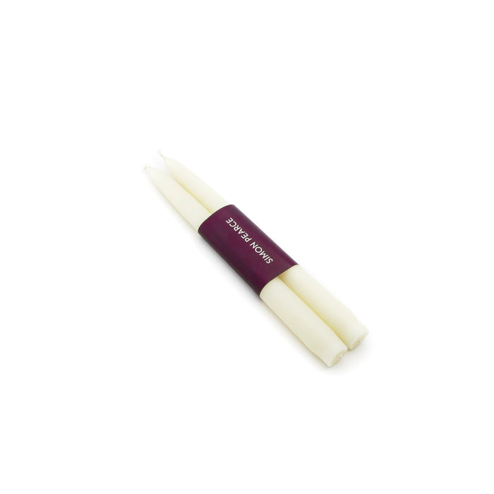 Two ivory taper candles bound together with a burgundy paper band labeled "SMITH NONKS".