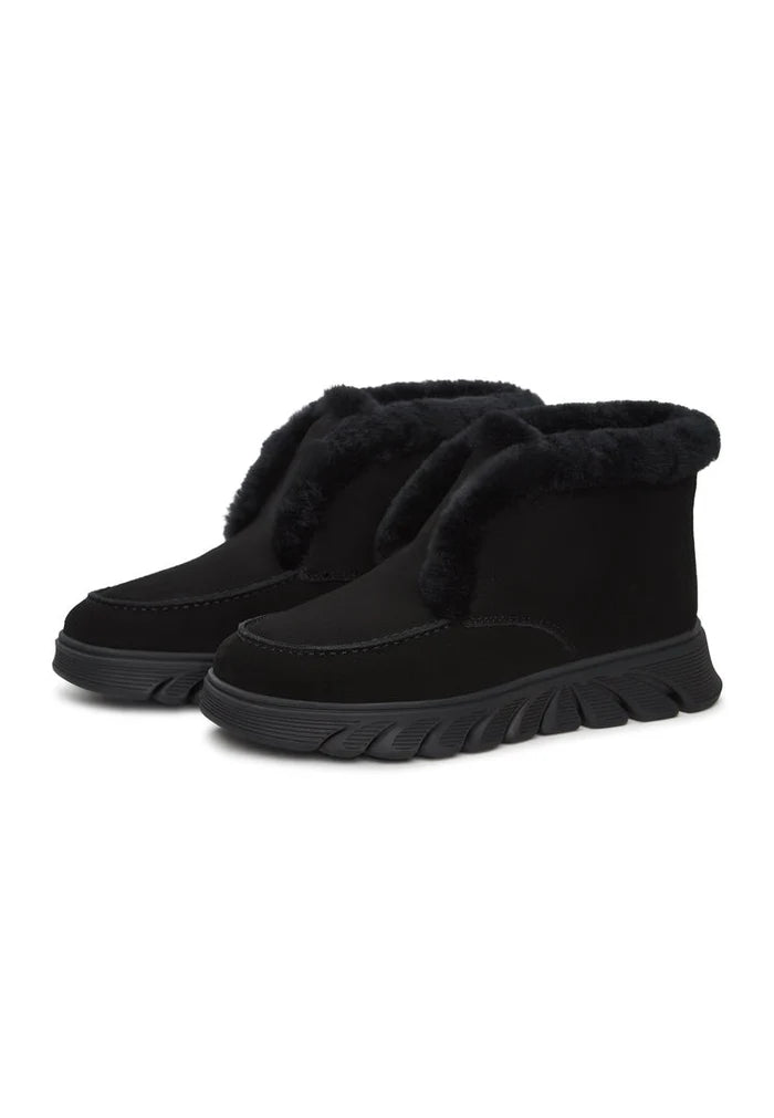 Stylish taupe shearling-lined Adriana black ankle boots, perfect for keeping warm and trendy during the colder months.
