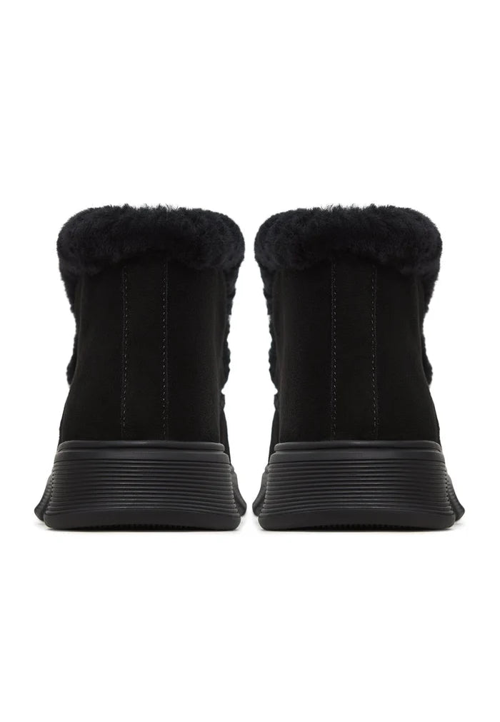 Look fabulous in these cozy taupe shearling-lined ankle boots, also known as Adriana black boots, perfect for the winter season.