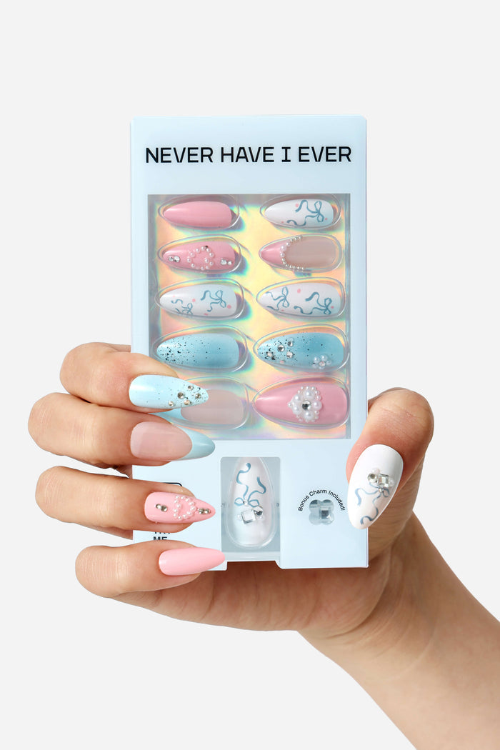 Light blue almond press-on nails with silver bow and rhinestone accents