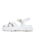 A pair of stylish white platform sandals, perfect for a classic urban look.