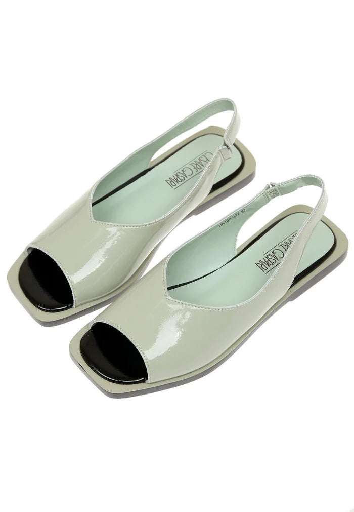 A stylish pair of open toe leather sandals, perfect for summer days and urban fashion-forward looks.
