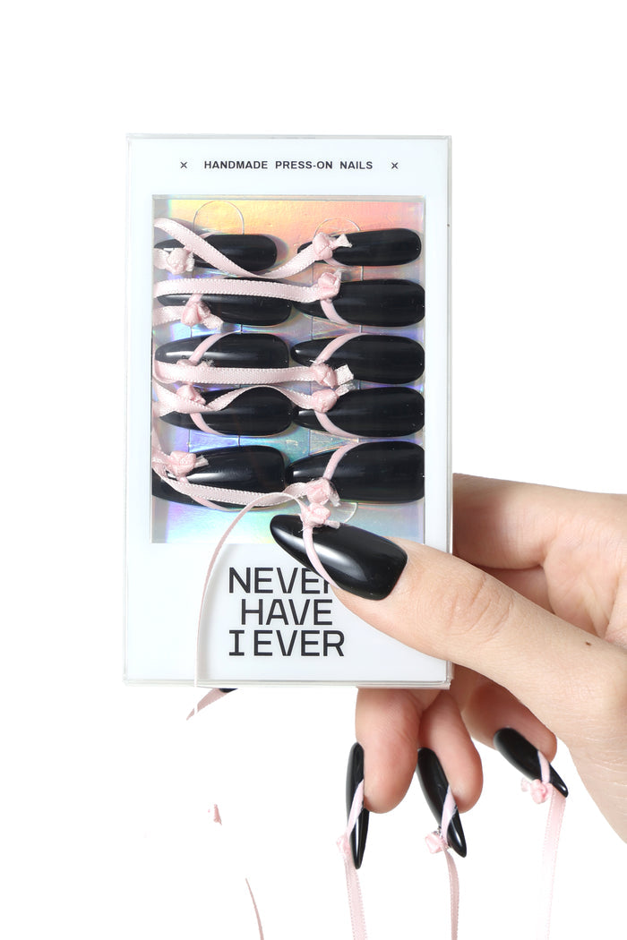 Black stiletto press-on nails with pink ribbon, branded 'NEVER HAVE I EVER'. Valentine's Bundle.
