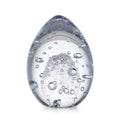 Translucent egg-shaped object filled with water and air bubbles in various sizes.