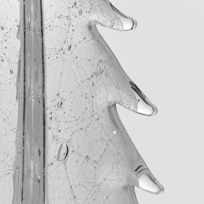 Clear glass candle with textured surface and three metal handles, shown against neutral background.