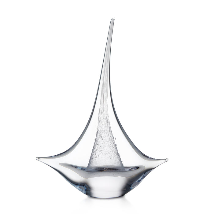 Clear glass sailboat sculpture with pointed mast and curved hull base.