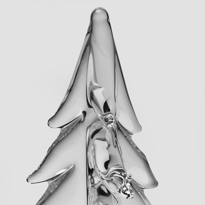 Clear glass evergreen tree ornament with textured trunk and layered branches.