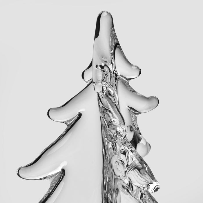 Clear glass evergreen tree figurine with twisted trunk and layered branches.