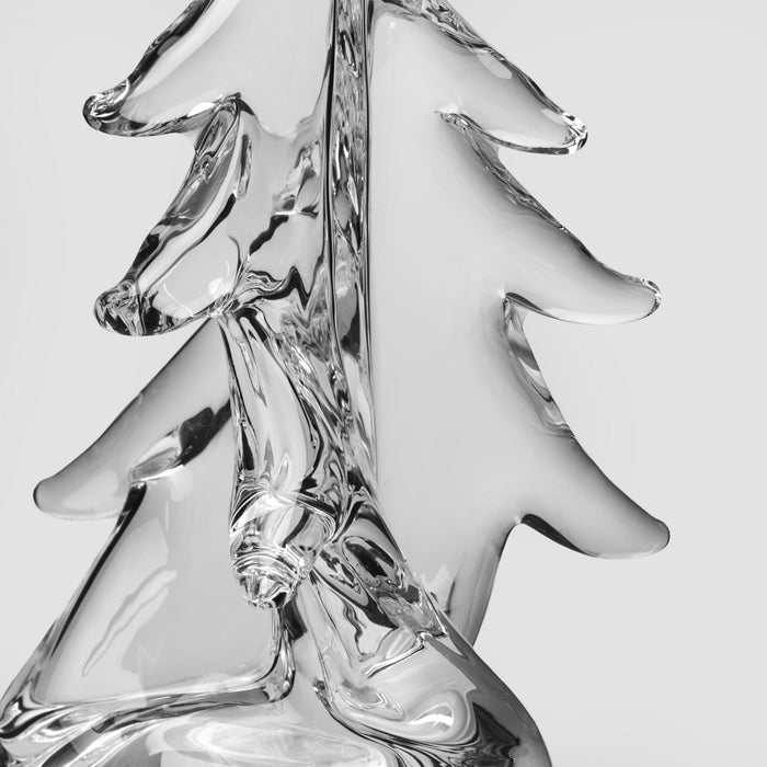 Clear glass evergreen tree-shaped ornament with twisted trunk and branch details.