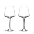 Two clear wine glasses with tapered bowls and thin stems on a white background.
