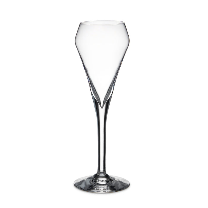Clear glass flute with tapered bowl, long stem, and solid base on white background.