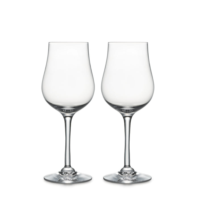 Two clear tulip-shaped wine glasses with thin stems and rounded bases on white background.