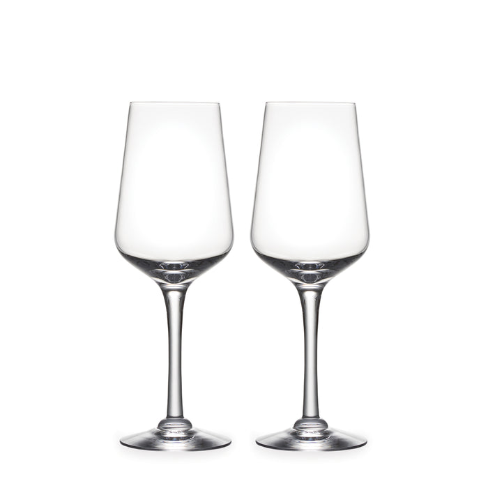 Two clear wine glasses with tapered bowls and thin stems on white background.