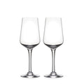 Two clear wine glasses with tapered bowls and thin stems on white background.