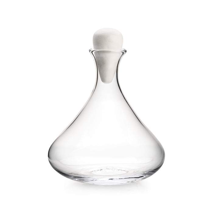 Clear glass wine decanter with wide bowl, narrow neck, and white marble dome stopper.