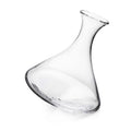 Clear glass wine decanter with curved body and angled pouring spout, tilted on rounded base.