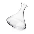 Clear glass wine decanter with curved body and angled spout, tilted at an angle.