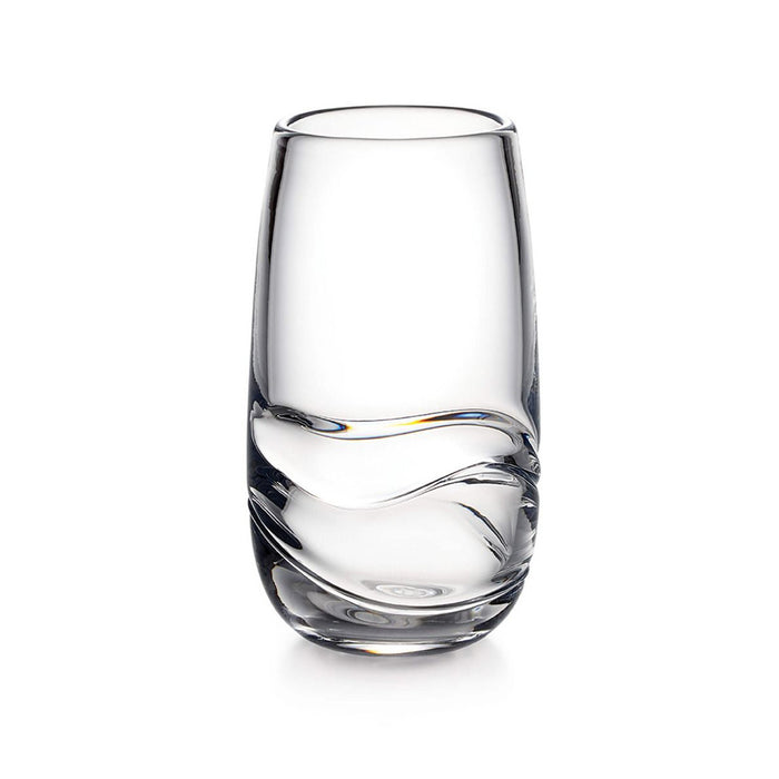 Clear glass tumbler with curved wavy design detail on lower half and tapered sides.