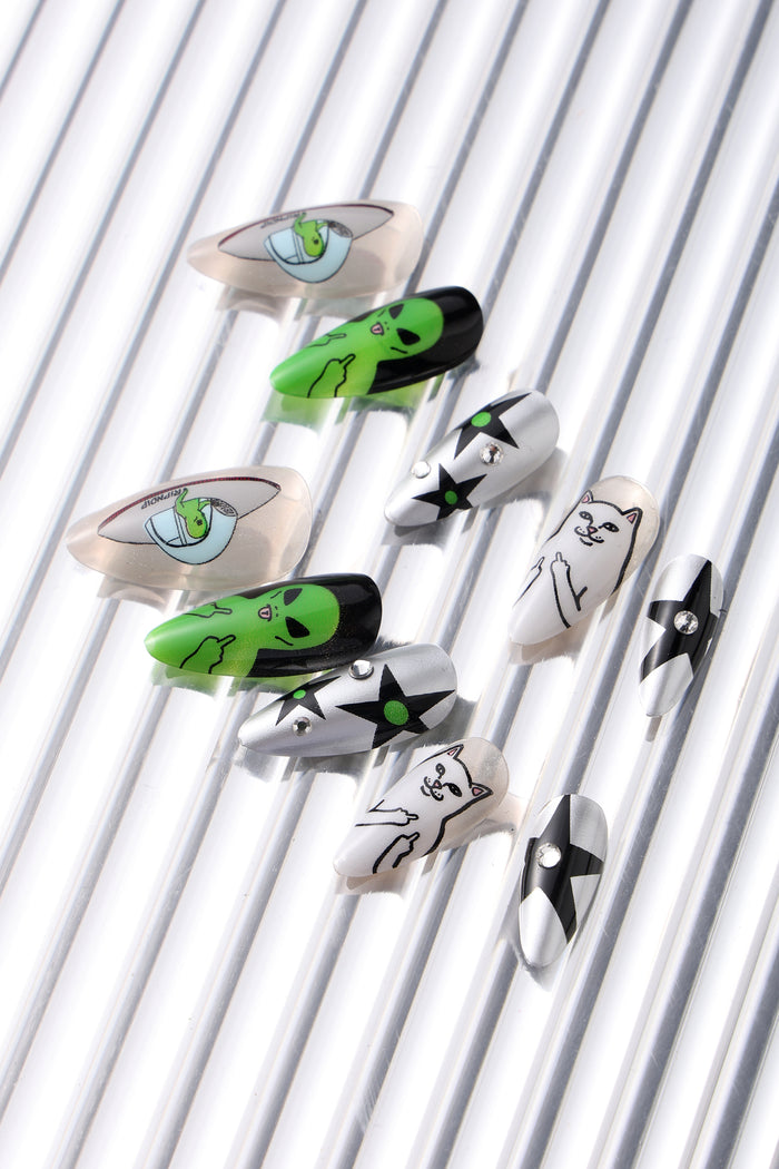 WE OUT HERE Ripndip press-on nails with alien and cat designs.