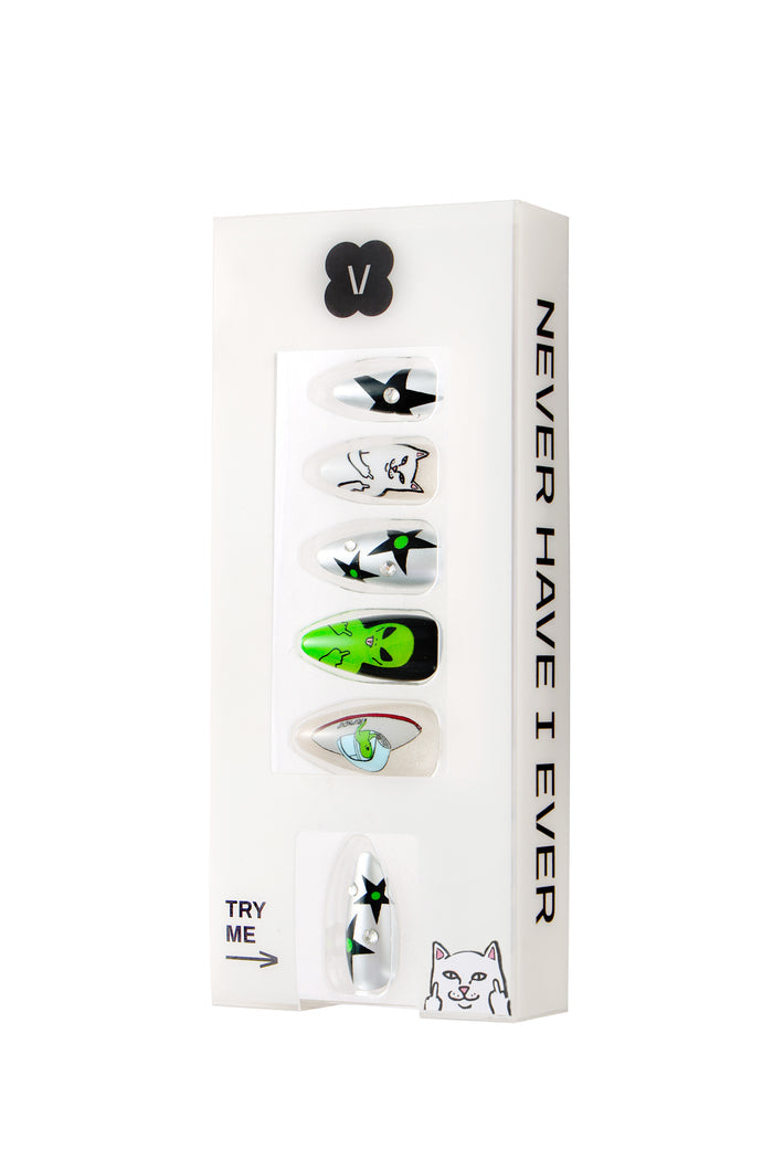 Ripndip 'WE OUT HERE' press-on nails featuring alien and cat designs with stars and rhinestones.