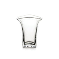Clear glass tumbler with flared rim and curved sides tapering toward a squared base.