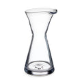 Clear glass pitcher with hourglass shape and pouring spout.