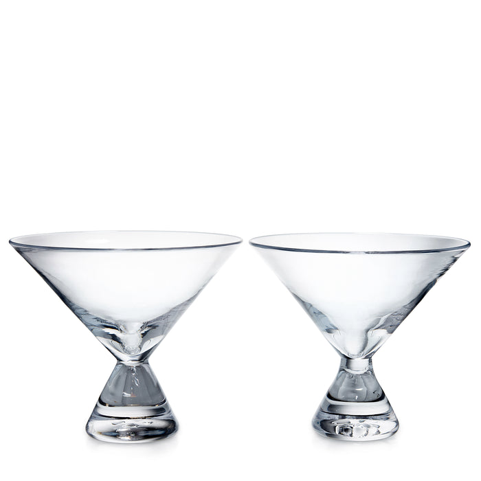Two clear glass stemless martini glasses with wide bowls and weighted bases.
