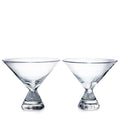 Two clear glass stemless martini glasses with wide bowls and weighted bases.