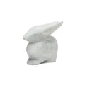 White marble rabbit sculpture with pointed ears and smooth, polished surface.