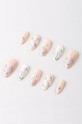 Wildflower Picnic press-on nails with floral and gingham designs in pastel colors.