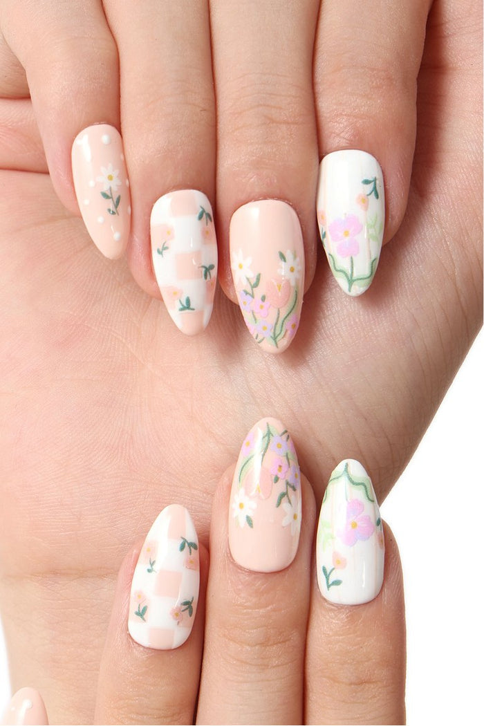 Press-on nails with floral and checkered patterns in pastel pink, white, and green. Wildflower Picnic by Elaine Lee.