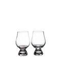 Two clear glass tasting glasses with tapered bowls and weighted bases.