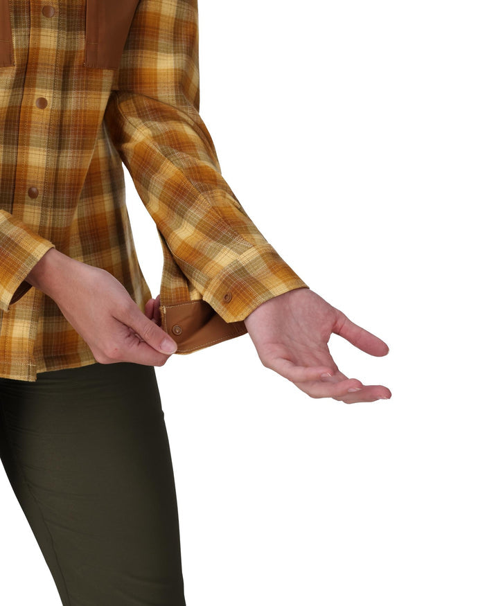Person wearing a plaid shirt with a white background