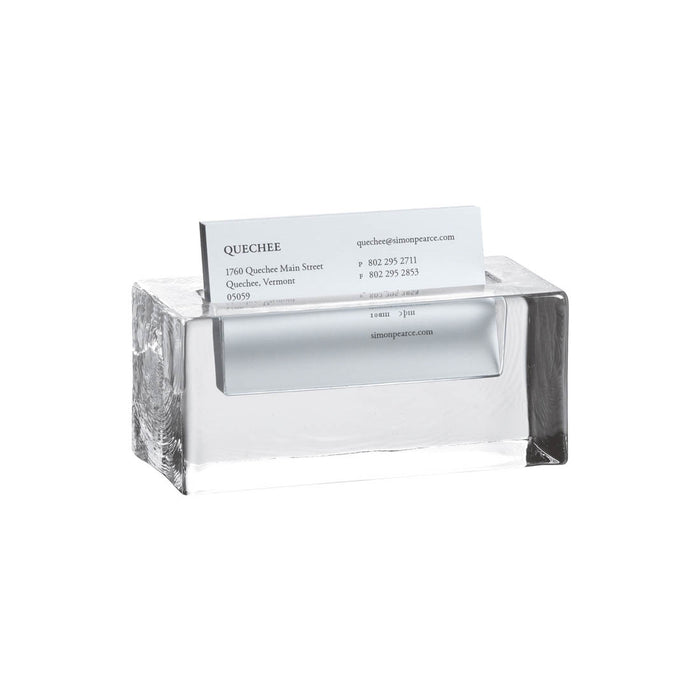 Clear acrylic cardholder with white interior slot holding a business card, featuring dark wood-grain sides.