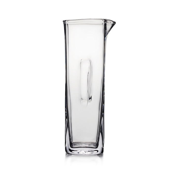 Clear glass cocktail carafe with a pouring spout and tall cylindrical shape.