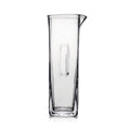 Clear glass carafe with tapered cylindrical body and pouring spout on upper right side.