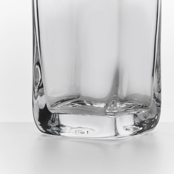 Clear glass cocktail carafe with squared sides and flat bottom.