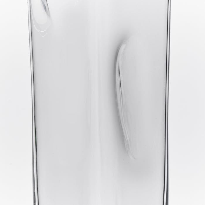 Clear glass carafe with curved handle and tapered pouring spout.