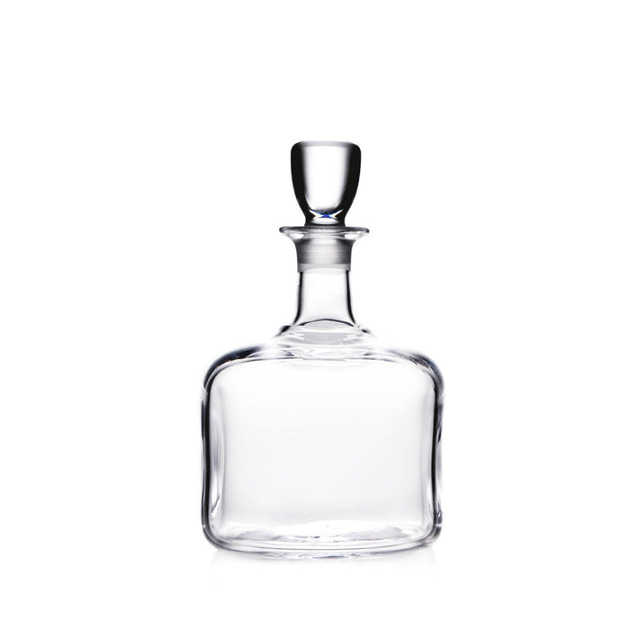 Clear glass decanter with a narrow neck, wide rounded body, and a rounded glass stopper.