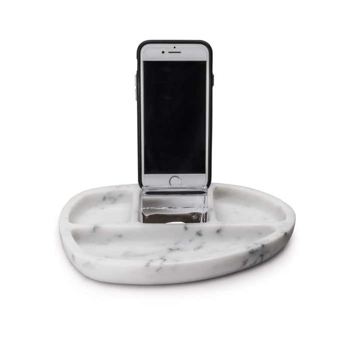 White marble oval desk caddy with compartments holding a smartphone in a black case.