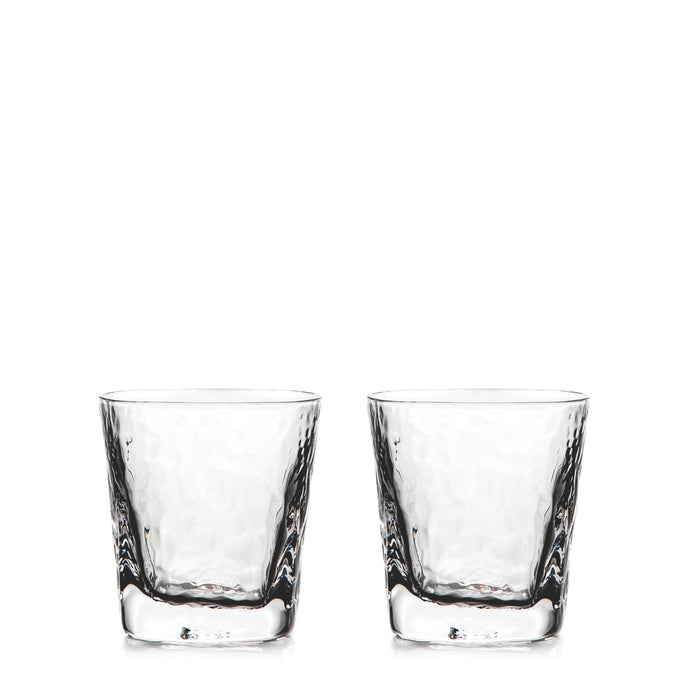 Two clear double old-fashioned glasses with textured sides and thick bases.