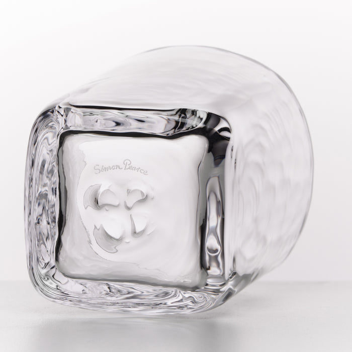 A clear glass block-shaped container with a textured outer surface and a smooth inner square compartment, photographed on a clean white background. The brand name 'Simon Paearce' is engraved on the outer surface.